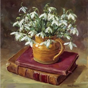 Blank, birthday or Christmas card depicting snowdrops in a brown china jug on leather bound books by Anne Cotterill.